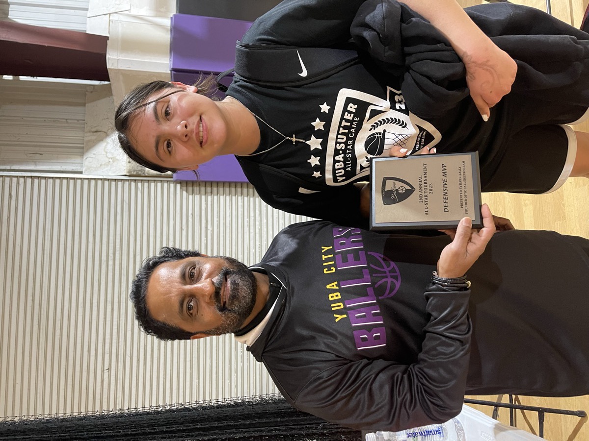 Founder Pinder Lally presenting the Defensive MVP award at the All-Star Tournament